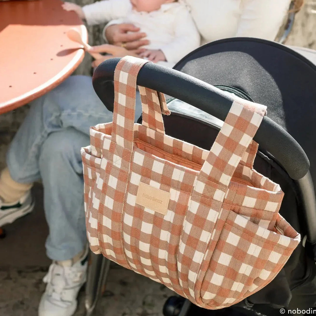 Nobodinoz a Scandinavian Children's brand. Image features stroller bag