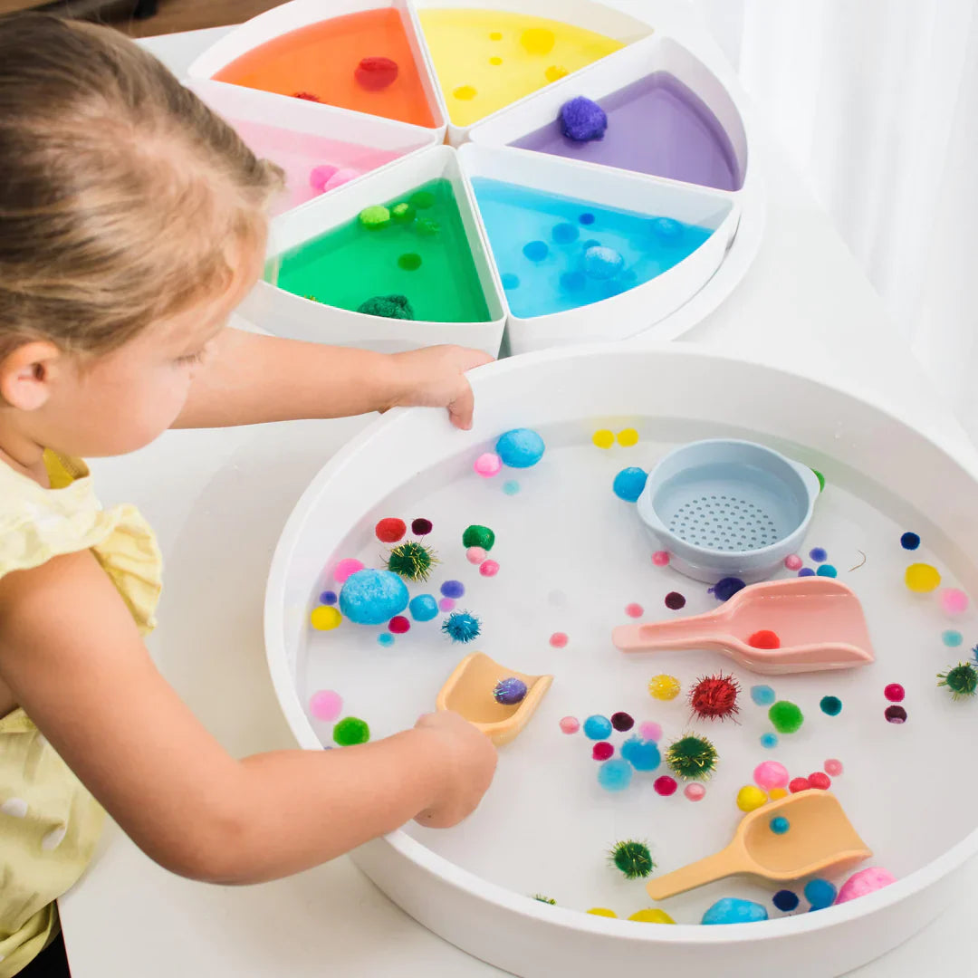 Inspire My Play offer sensory friendly activity toys. Image shows young girl enjoying playtime with her Inspire My Play PlayTray.